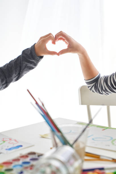 istock Unrecognizable kids making heart gesture 2166135861