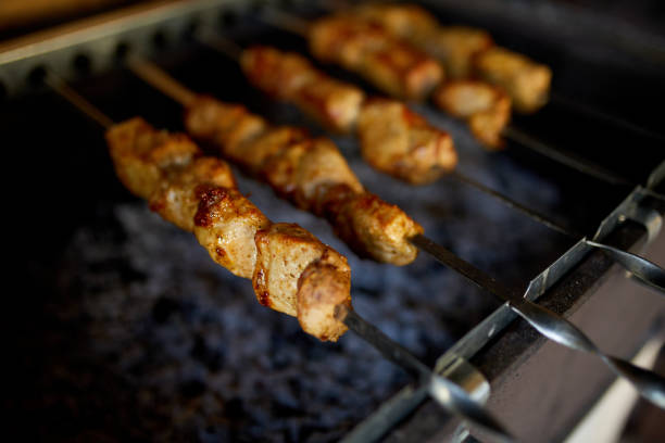 istock Summer Barbecue at Home Featuring Kebabs Grilling in a Backyard Grill 2166142642