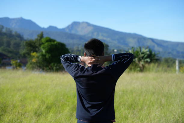 Man holding doing yoga in nature