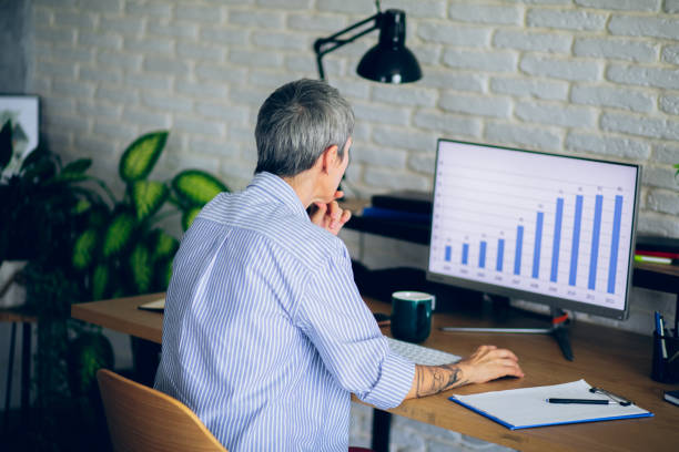 istock Mature woman working at her home office 2166152440