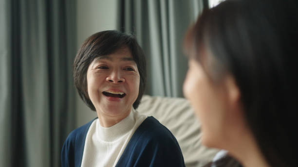 istock Mother relax talking with her daughter on sofa at home. 2166152548