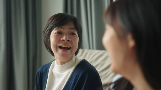 istock Mother relax talking with her daughter on sofa at home. 2166152553