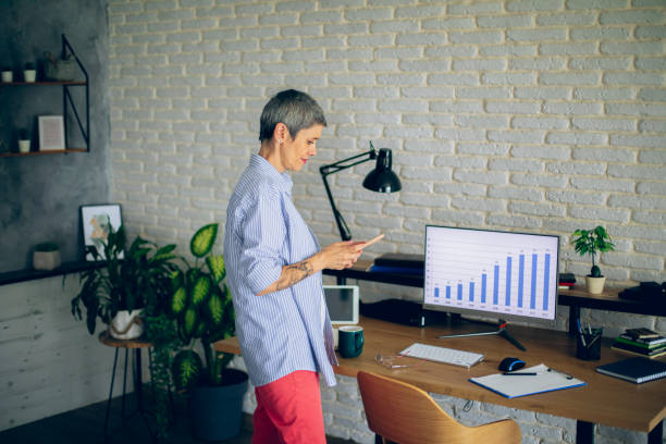 istock Mature woman working at her home office 2166152589