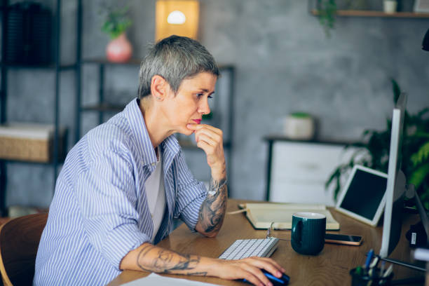 istock Mature woman worried while working from home 2166154231