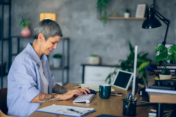 istock Mature woman working at her home office 2166154694