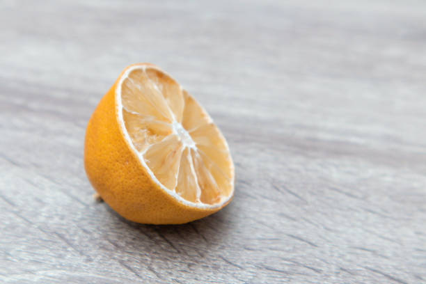 Rotten ripe half lemon Excessive consumption, wasting money