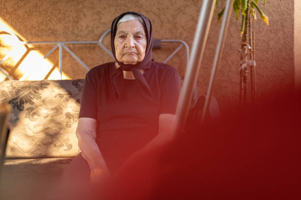 Portrait of senior woman sitting on a sofa in living room, Mugla Turkey