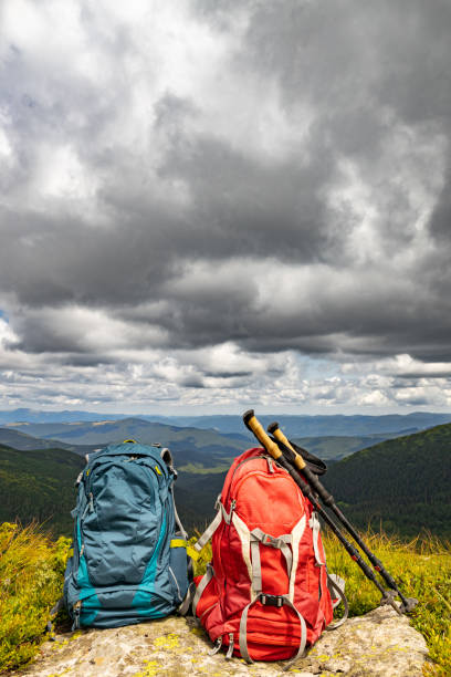 Mountain landscape with peaks and backpacking equipment.