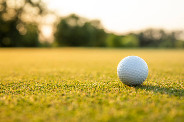 istock Golf ball and clubs in golf field 2166168206
