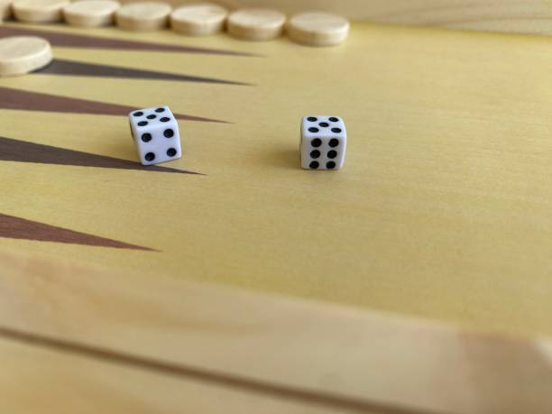 istock Backgammon game. Wooden board with backgammon game pieces with dice 2166171452