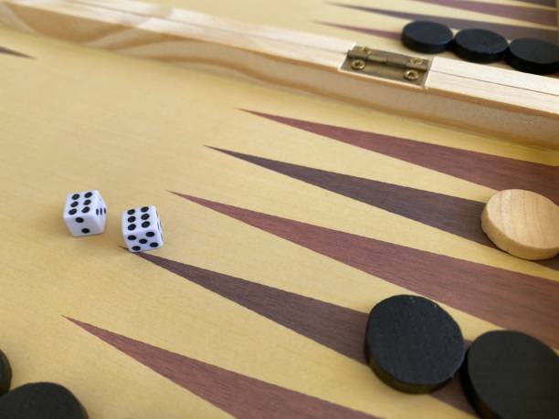 istock Backgammon game. Wooden board with backgammon game pieces with dice 2166171472