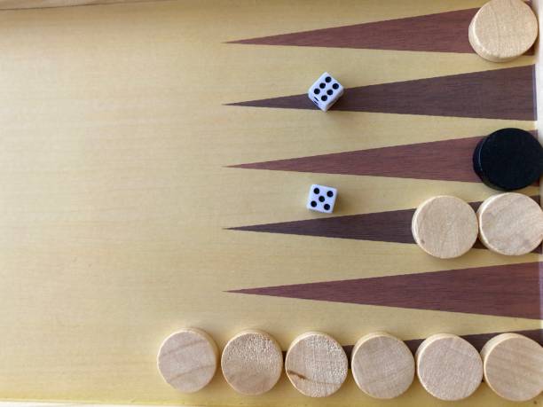 Backgammon game. Wooden board with backgammon game pieces with dice