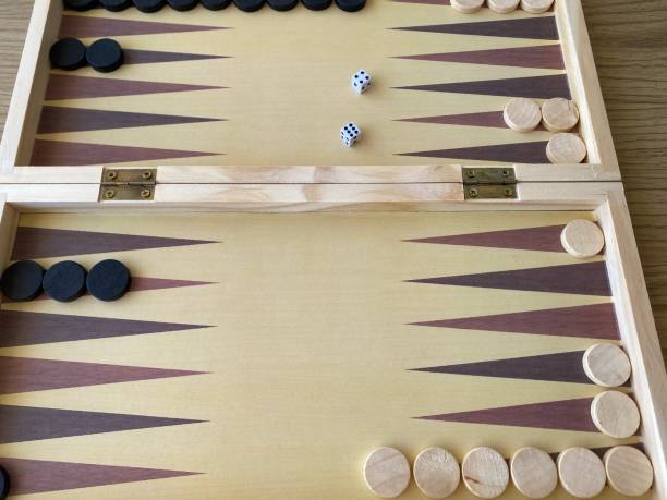 istock Backgammon game. Wooden board with backgammon game pieces with dice 2166171981