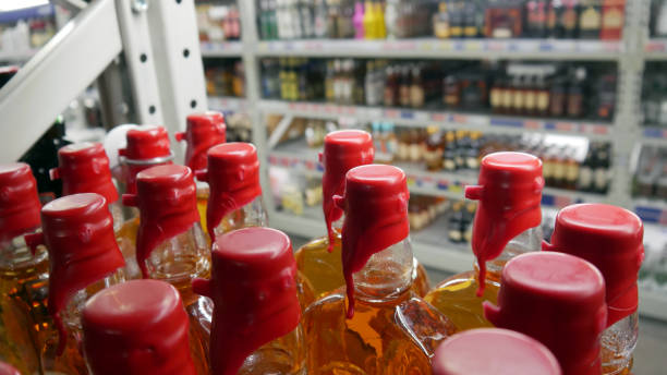 istock Many whiskey bottles with red sealing wax corks 2166177655