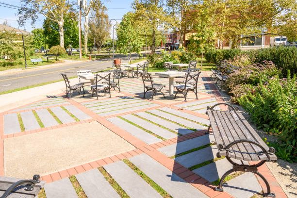 Empty park with chess tables and benches in a town centre