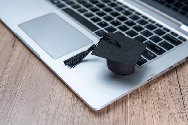 istock A graduation cap and a laptop. 2166181755