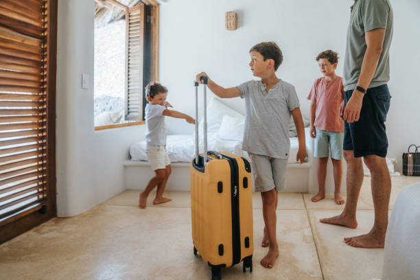 istock Father with his sons arriving at their vacation destination 2166188648