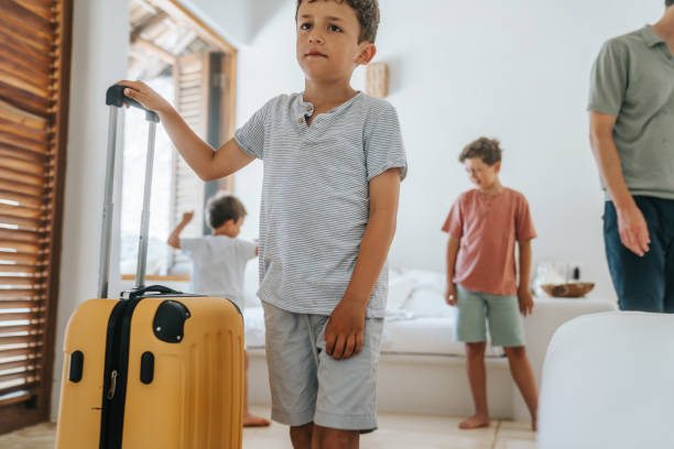 istock Father with his sons arriving at their vacation destination 2166188660
