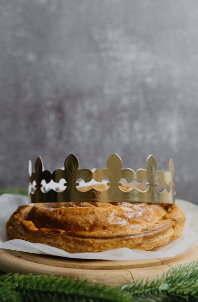 istock One whole fresh royal galette with a crown on a gray background. 2166195706