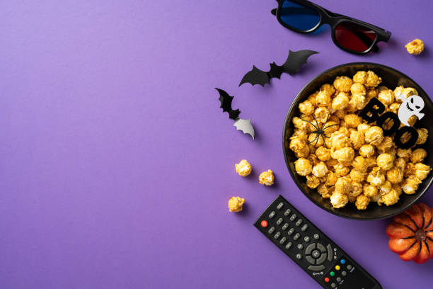 istock Halloween movie night setup with popcorn and spooky decor 2166202898