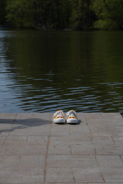 Yellow sneakers in summer nature