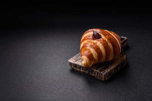 istock Delicious crispy sweet croissant cornet with chocolate 2166209074