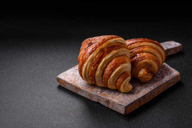Delicious crispy sweet croissant cornet with chocolate