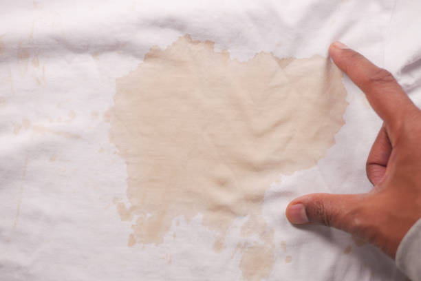 istock spilled coffee on a white shirt 2166209472