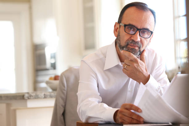 istock Hispanic Businessman Working From Home On Computer 2166211872