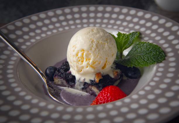 istock Blueberry pie with ice cream 2166212024