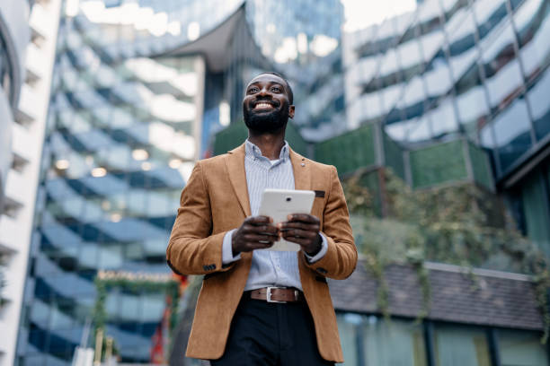 istock Happy businessperson using tablet in city environment 2166213639