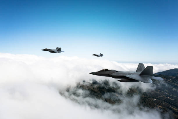 istock Jet aircrafts flying over the clouds. 2166220762