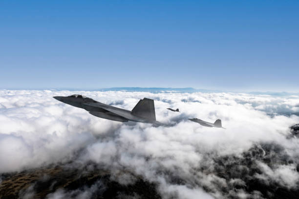 istock Jet aircrafts flying over the clouds. 2166220806
