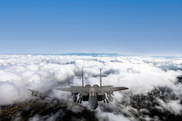 istock Jet aircrafts flying over the clouds. 2166220811
