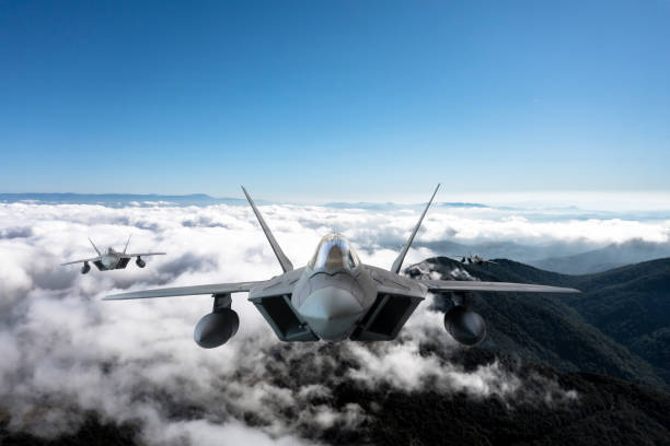 istock Jet aircrafts flying over the clouds. 2166220877