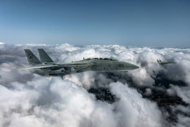 istock Jet aircrafts flying over the clouds. 2166220911