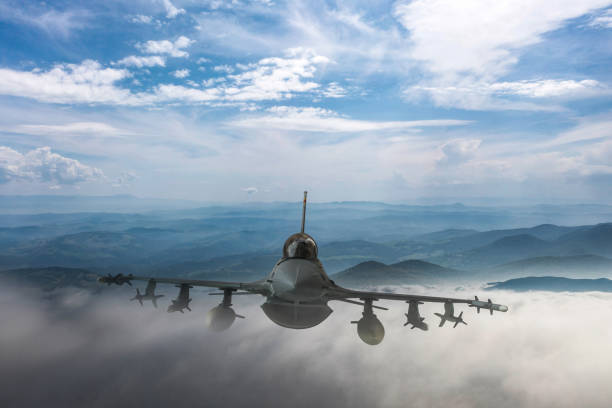 istock Jet aircrafts flying over the clouds. 2166220956