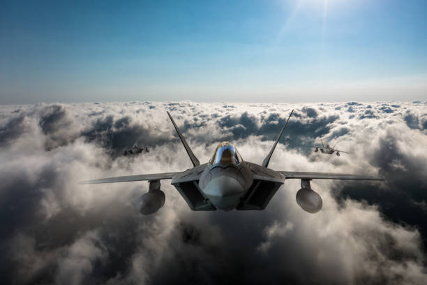istock Jet aircrafts flying over the clouds. 2166221519