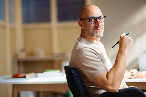 Confident Professional Man Working In Modern Office