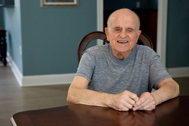 istock Senior man sitting smiling 2166224595