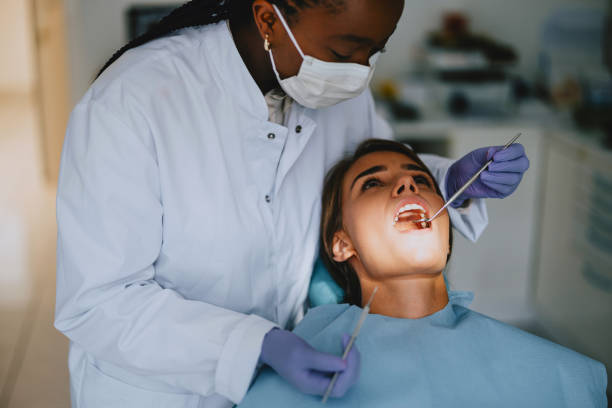 istock Dentist Examining Patient's Teeth in Modern Dental Office 2166226992