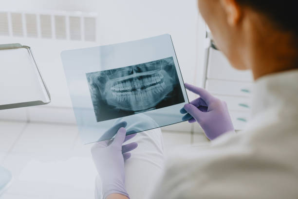 istock Dentist Analyzing Dental X-Ray Image in Clinic 2166226998