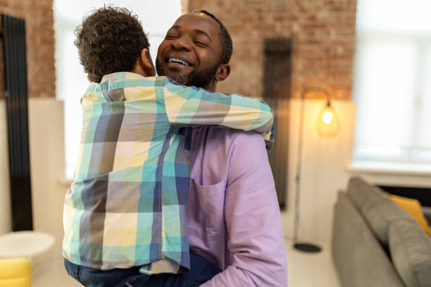 istock Dad and son hugging and looking happy and enjoyed 2166232793