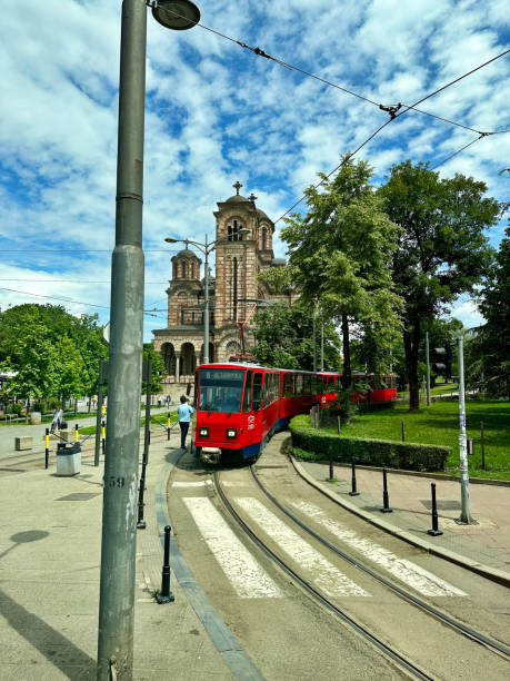 Belgrade, Serbia - May 9, 2024 - Red tram in the downtown area of Belgrade. The first tram line was introduced October 14, 1892 and now the city has 12 routes.