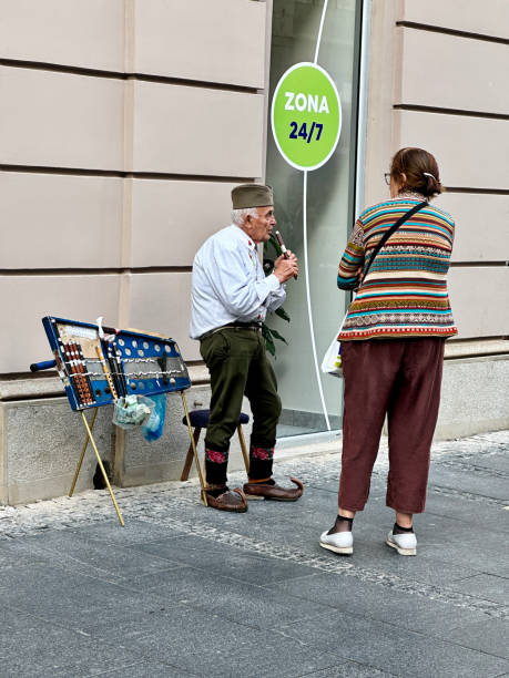 sad unhappy young bearded man showing his purse with money, woman is very happy as she wants to spend her husband's salary. close up photo.lifestyle