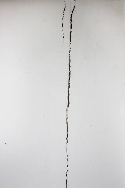 istock Cracked cement wall caused by house collapse. 2166235682