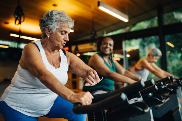 Group of mature women practicing together in a luxury spa