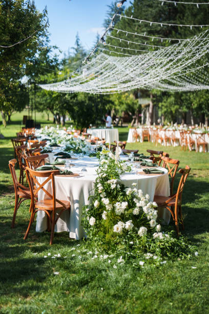 istock Tables decorated with flowers for a rustic wedding reception 2166245887