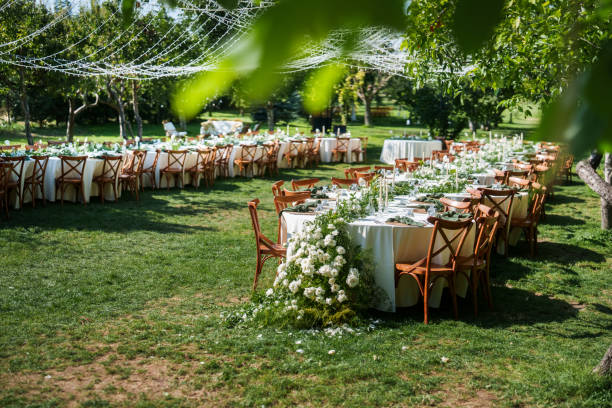 istock Tables decorated with flowers for a rustic wedding reception 2166246059