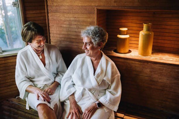 istock Two mature women inside a sauna having conversations in a spa 2166246279